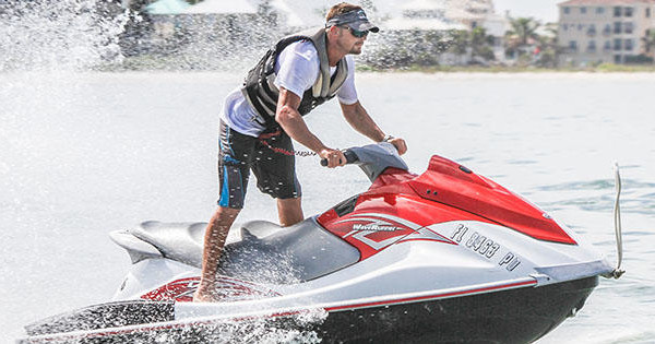 Man making waves while jet skiing